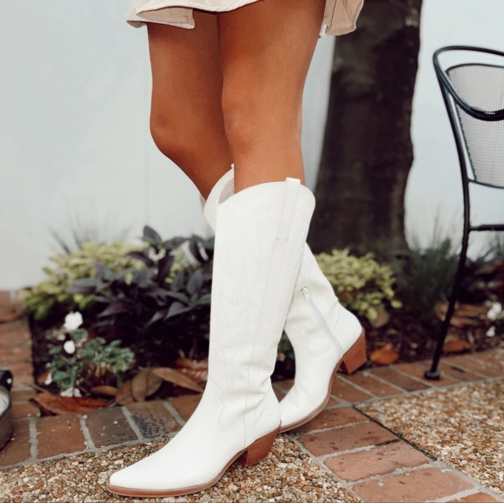 White cowgirl boots. Worn only once or twice. No stains or rips.